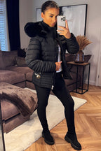 Black Puffer Jacket With Faux Fur Hood And Gold Belt
